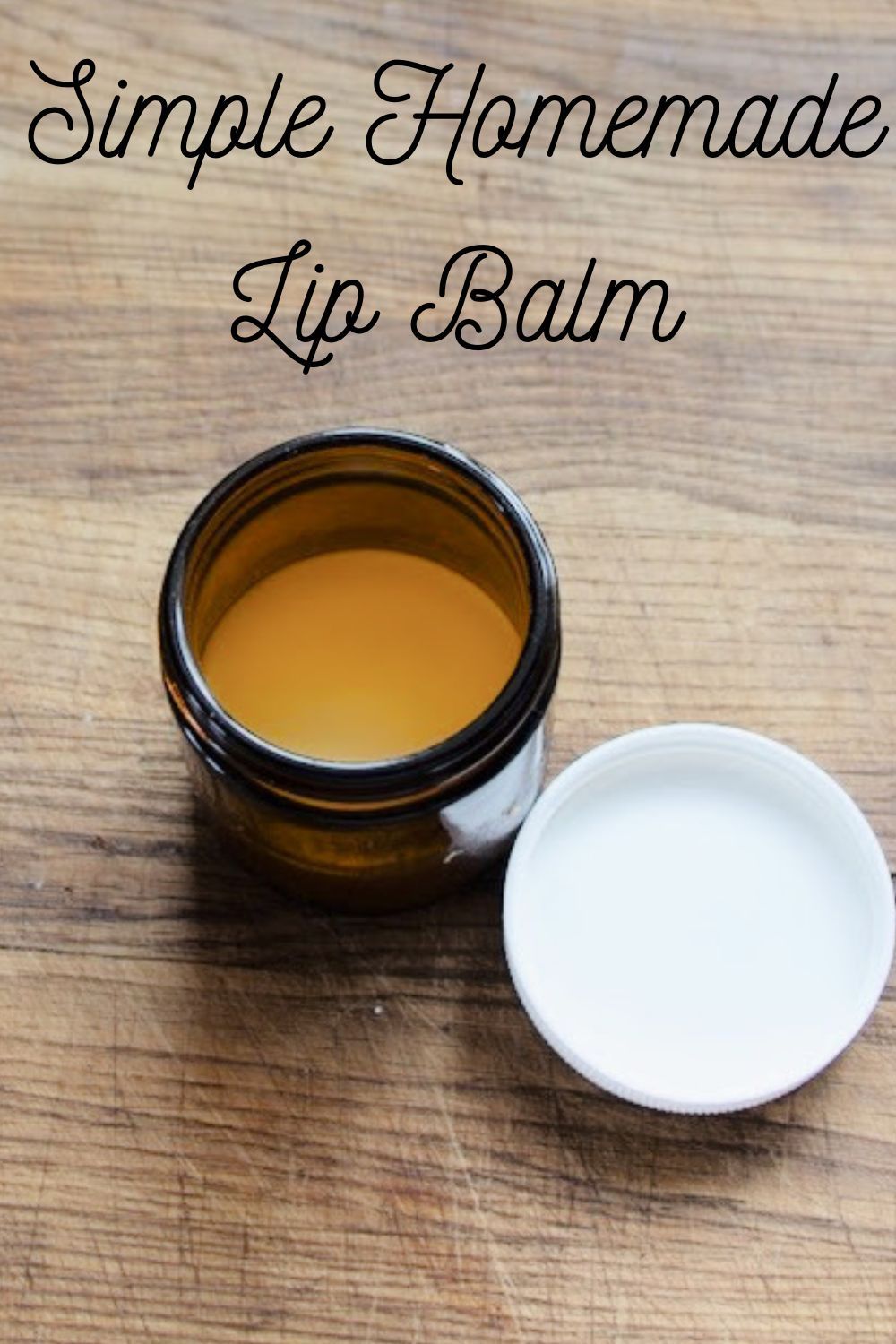 Jar of lip balm on a wooden board