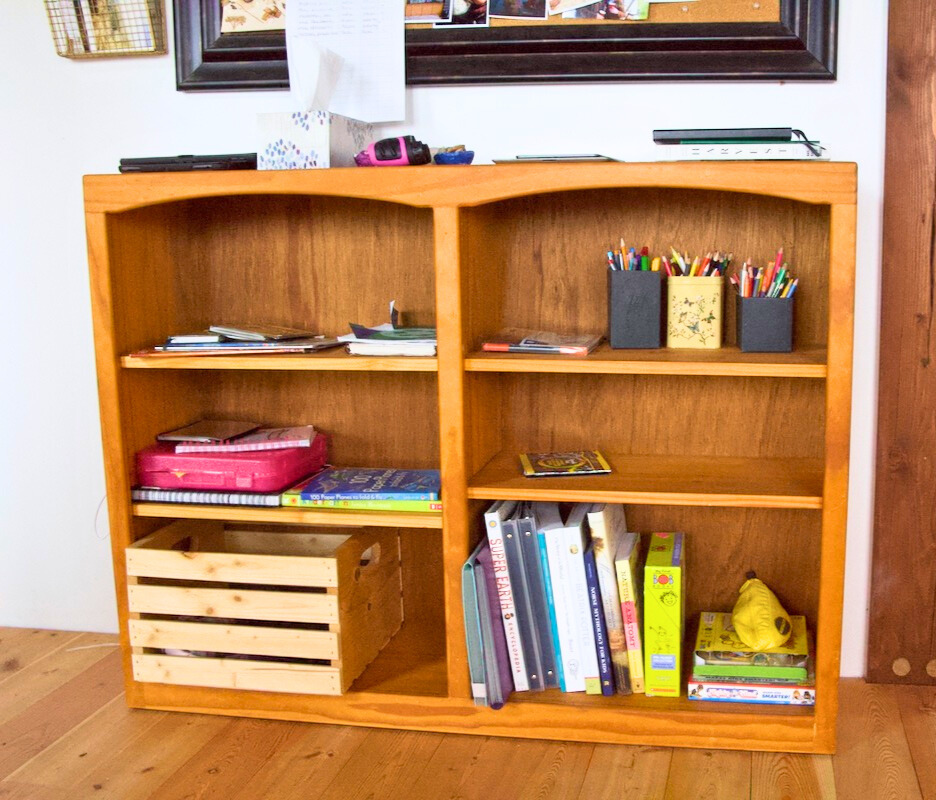 Shelf in a room with school supplies