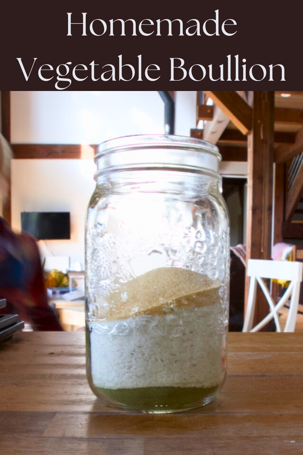 Jar of vegetable bouillon sitting on a wooden counter top in a kitchen