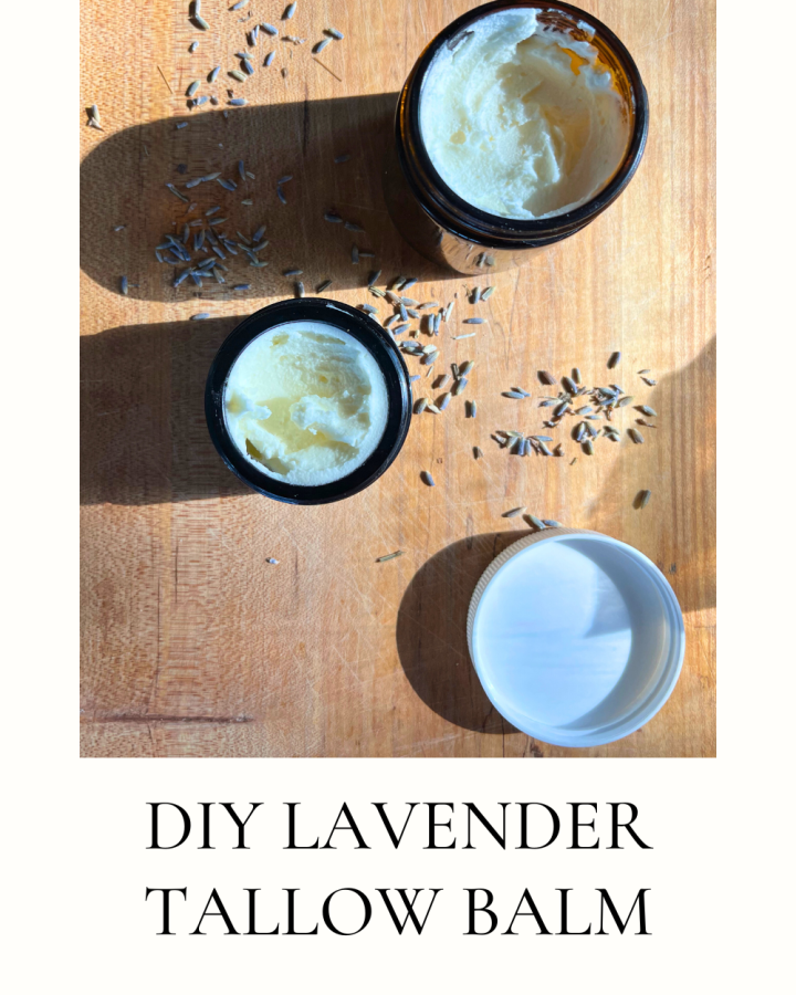2 jars of lavender tallow balm on a wooden board with dried lavender sprinkled around it