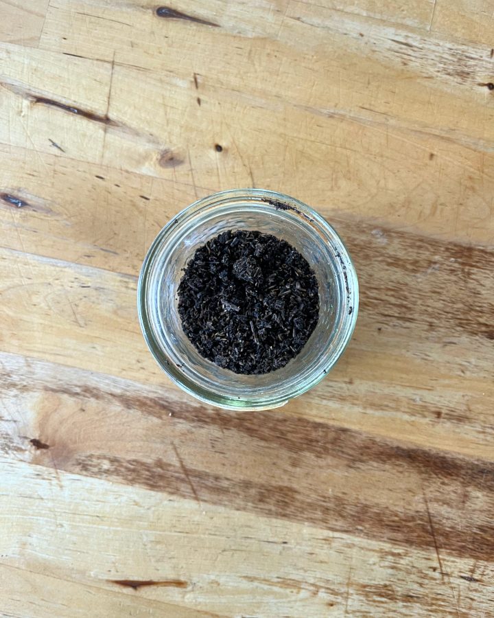 dehydrated, ground up vanilall beans in a ajar