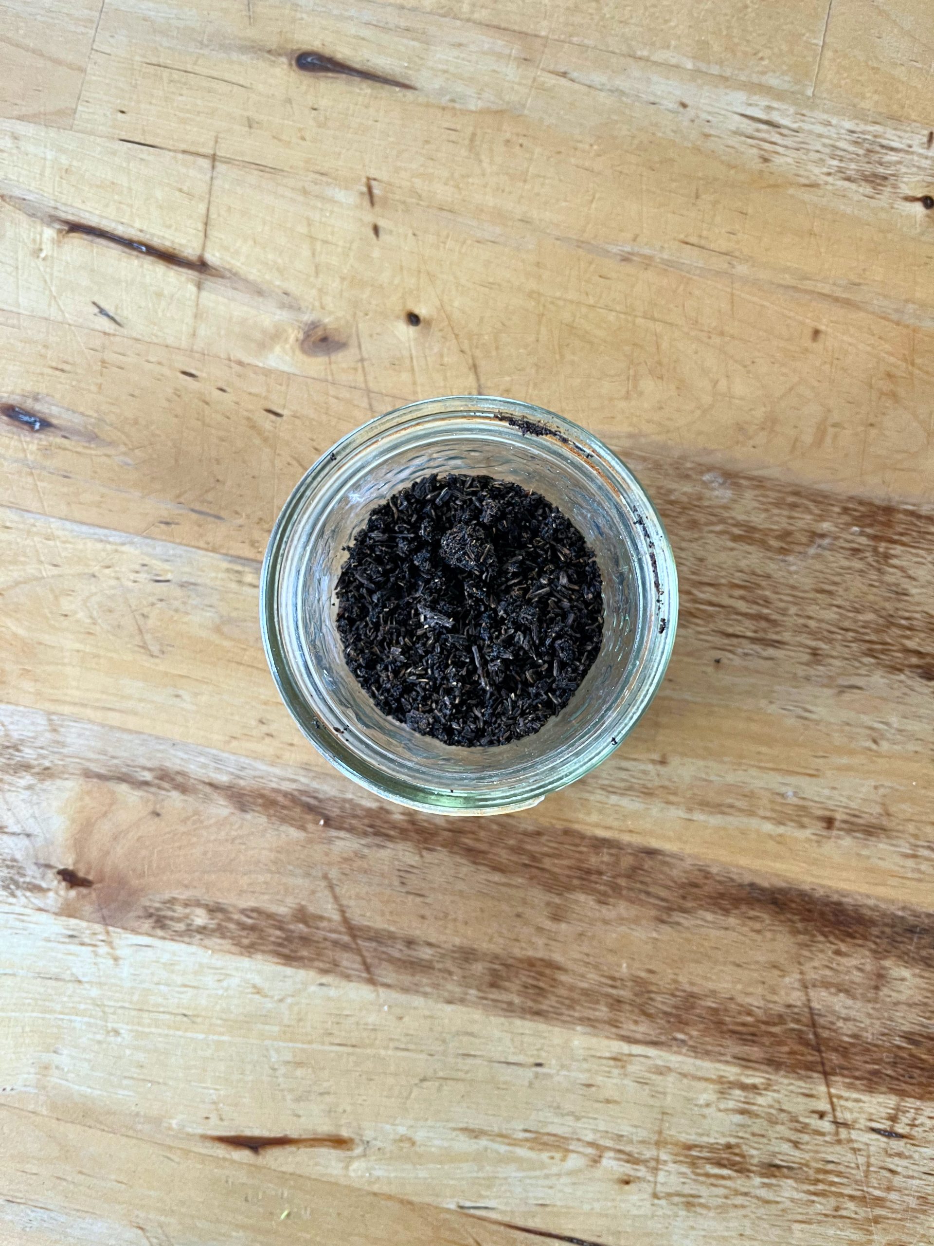 dehydrated, ground up vanilall beans in a ajar