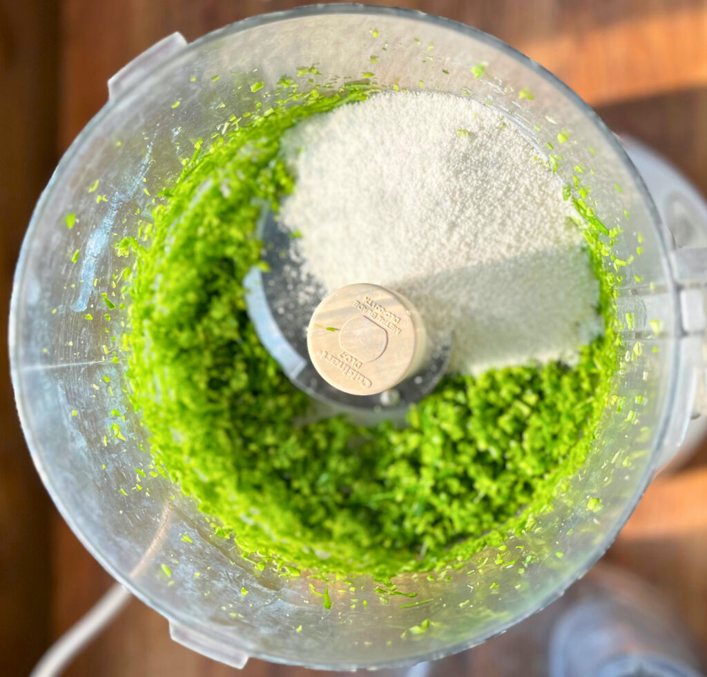 roughly chopped garlic scapes and sea salt in a food processor